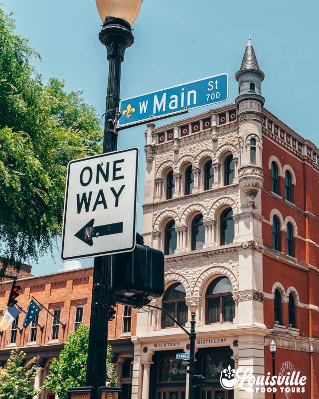 Downtown Louisville main street sign in front of Michters Distillery