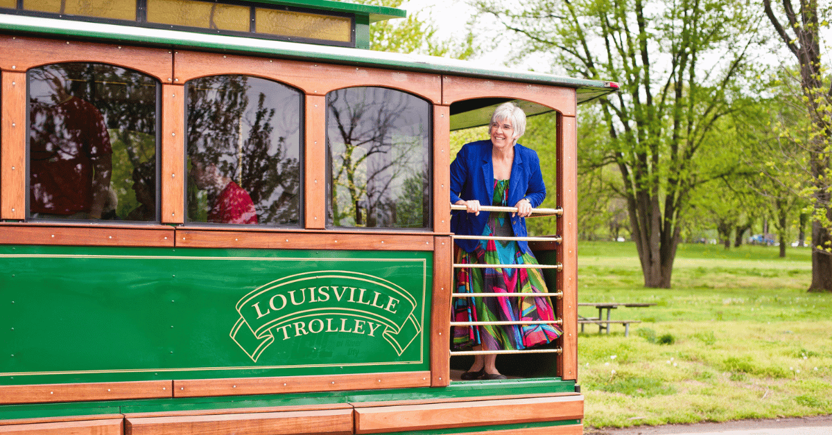 Trolley in Louisville KY with woman looking out from balcony