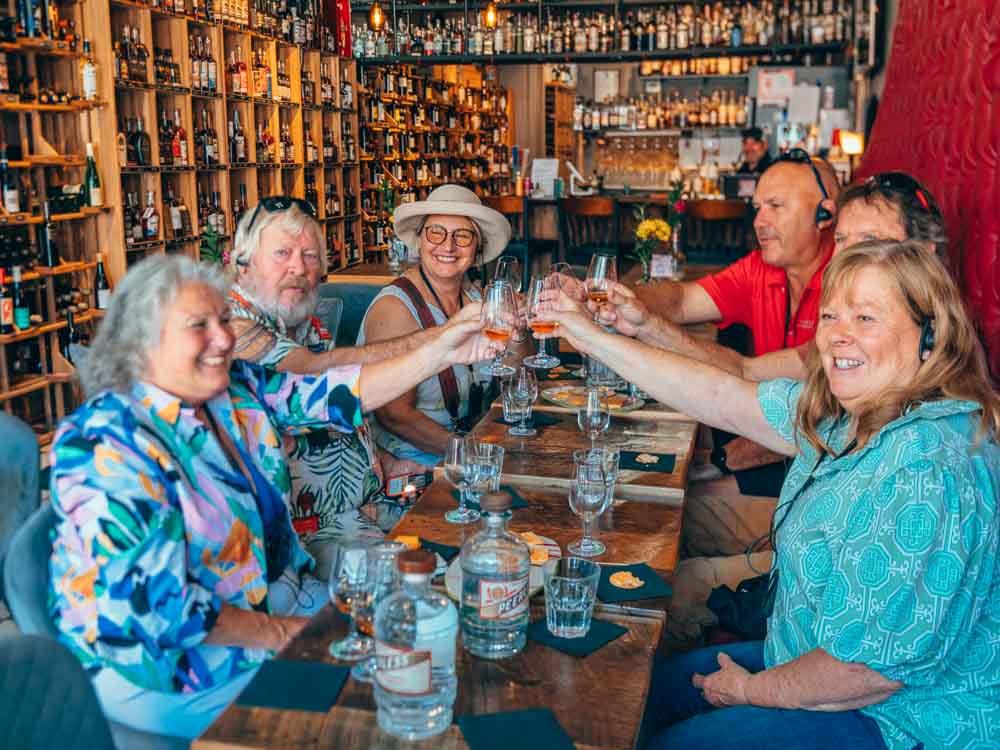 Bourbon Trolley Tour group toasting bourbon pours